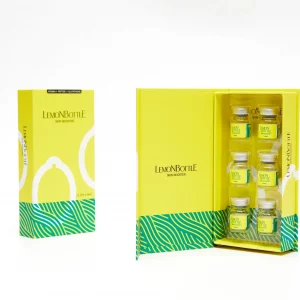 LemonBottle Skin Booster product packaging displayed on a white background. The image shows a closed yellow box with green patterns and a lemon graphic on the left, labeled "LEMONBOTTLE SKIN BOOSTER." On the right, the box is opened to reveal six small transparent vials filled with a yellow solution, neatly arranged in compartments inside the box.