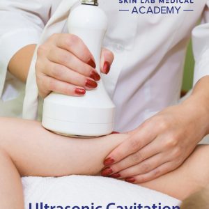 A professional in a white coat performs an ultrasonic cavitation procedure on a client's thigh using a handheld device. The professional has red painted nails, and the client is lying down in a treatment setting.