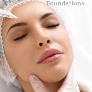 Close-up of a woman receiving an anti-wrinkle injection on her forehead. She is lying down with her eyes closed, wearing a disposable hair cap. A practitioner wearing transparent gloves gently supports her chin.