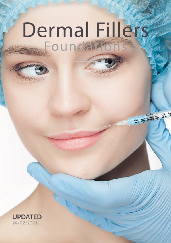 Close-up of a woman receiving a dermal filler injection in her lips, with a practitioner wearing blue gloves gently holding her chin. The woman is wearing a blue surgical cap and looking sideways with a slight smile.