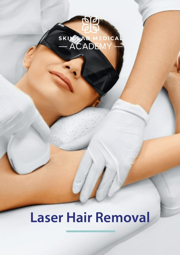 Smiling woman wearing protective goggles receives underarm laser hair removal treatment at Skin Lab Medical Academy, performed by a technician wearing white gloves and using a handheld device.